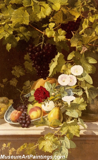 A Still Life With Fruit Flowers And A Vine